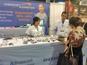 Showing an AORN attendee our table of sinus forceps, hysteroscopes, and kerrisons.